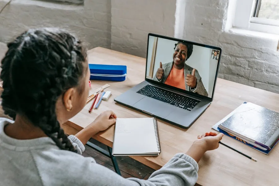Mentor with a learner at a screen