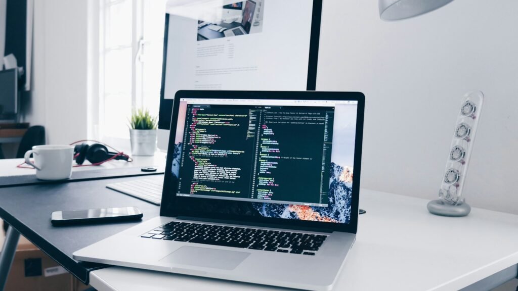 A laptop and monitor on a developer desk